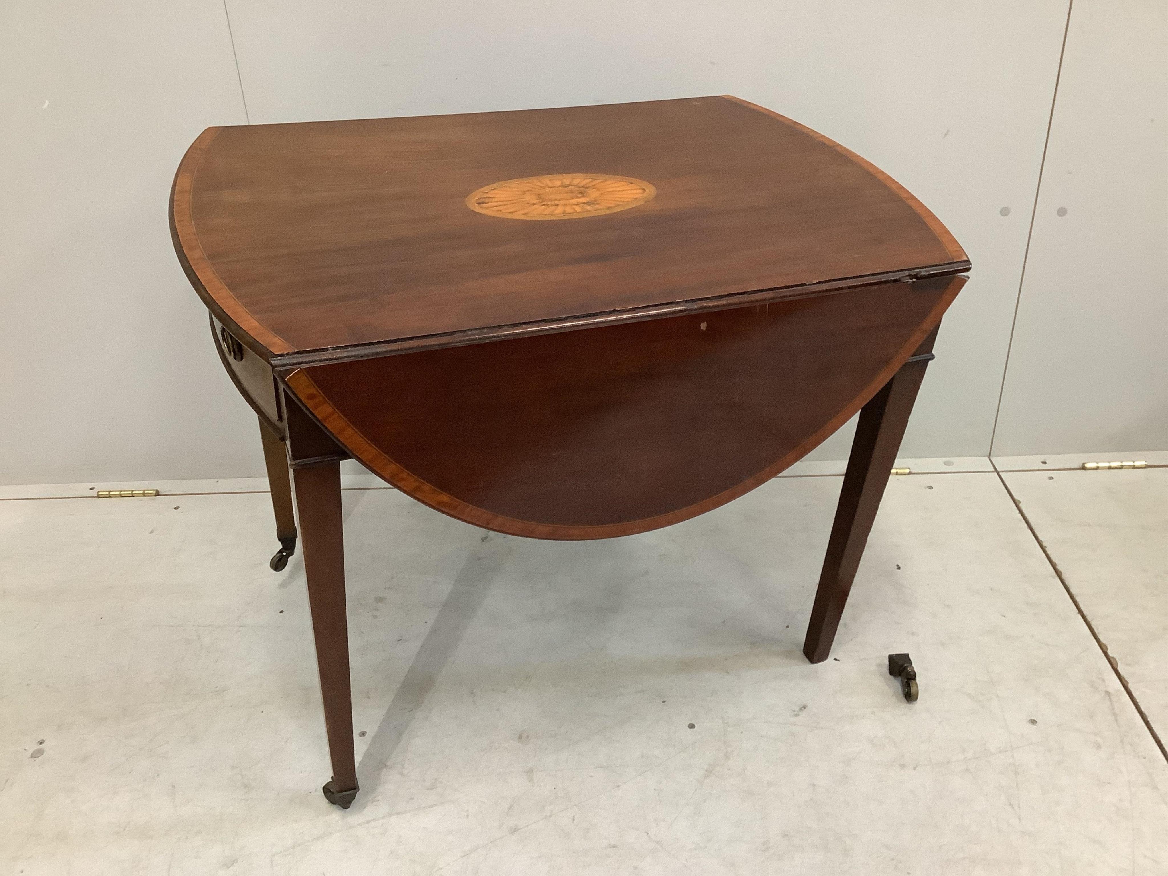 A George III crossbanded and paterae inlaid mahogany Pembroke table, width 83cm, depth 55cm, height 70cm. Condition - poor to fair